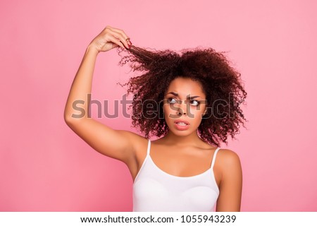 Similar – Image, Stock Photo Upset black woman with dreadlocks against concrete wall