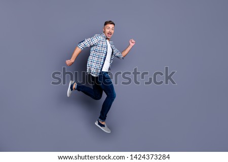 Similar – Dreamy modern man walking along city street