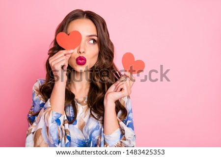 Close-up portrait of her she nice-looking attractive lovely coquettish cheerful cheery wavy-haired girl holding in hands two small little heart sending you kiss isolated over pink pastel background