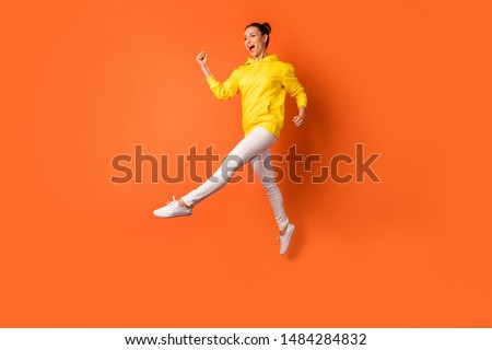 Similar – Image, Stock Photo Dreamy woman raising leg while standing near fence