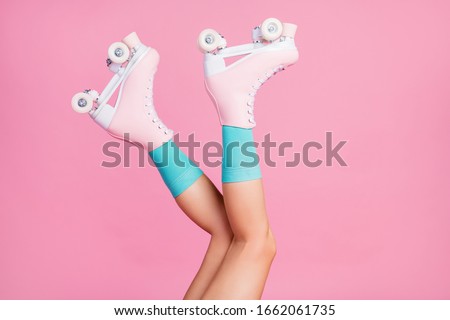 Similar – Image, Stock Photo Woman legs wearing retro quad roller skates on yellow background