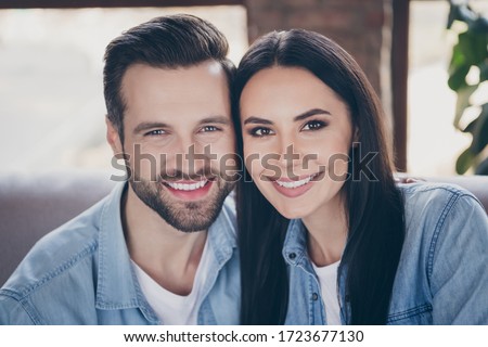 Close up photo of idyllic passionate loving family woman man enjoy spend quarantine together toothy smile wear denim jeans shirt in house room apartment indoors