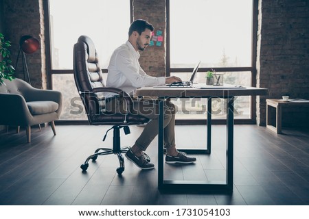 Similar – Image, Stock Photo Young stylish handsome man in suit with suitcase standing on metro station holding smart phone in hand, scrolling and texting, smiling and laughing.  Train passing by