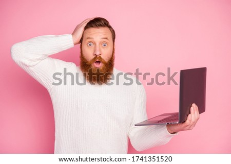 Portrait of astonished guy work on computer search incredible discounts impressed feel stupor stare wear good look pullover isolated over pastel color background Foto d'archivio © 