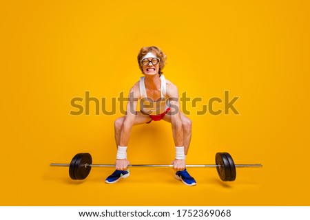 Full length body size view of his he nice funky slim motivated desperate foxy guy lifting barbell doing work out coacher program isolated over bright vivid shine vibrant yellow color background Photo stock © 