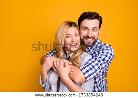 Similar – Image, Stock Photo Smiling couple embracing in forest sitting on tree roots