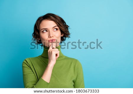 Portrait of minded woman touch hand chin look copyspace think thoughts plan autumn holiday wear jumper isolated over blue color background