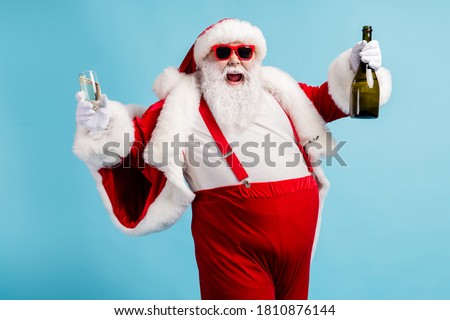 Similar – Foto Bild Älterer Mann öffnet Champagnerflasche während der Weihnachtsfeier zu Hause