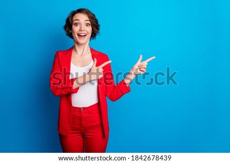 Portrait of attractive excited amazed cheerful lady demonstrating copy space offer black friday isolated on bright blue color background Foto stock © 