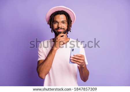 Similar – Image, Stock Photo Trendy ethnic model touching hair in projector light