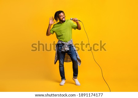 Similar – Image, Stock Photo Man holds a microphone in his hand ready to speak