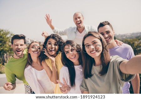 Similar – Image, Stock Photo Positive ethnic woman photographing on retro camera in city park