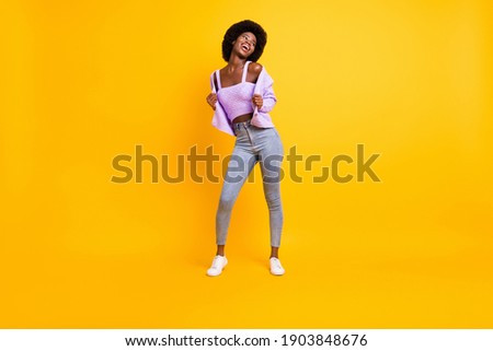 Full size portrait of nice dark skin person look empty space enjoy dancing wear purple isolated on yellow color background 商業照片 © 