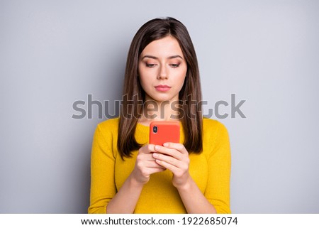 Image, Stock Photo Serious woman browsing smartphone at home