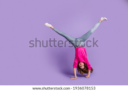 Full size photo of young happy cheerful good mood positive girl hand standing isolated on violet color background 商業照片 © 