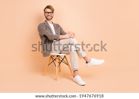 Similar – Image, Stock Photo Stylish man sitting at airport with suitcase and laptop, working, typing, browsing. Businessman traveling.