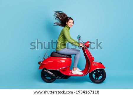 Similar – Image, Stock Photo Young long hair motorbike guy checking his phone while sitting on his old school motorbike during a break from the road route. Liberty life, young man heavy metal, white tshirt and gloves.