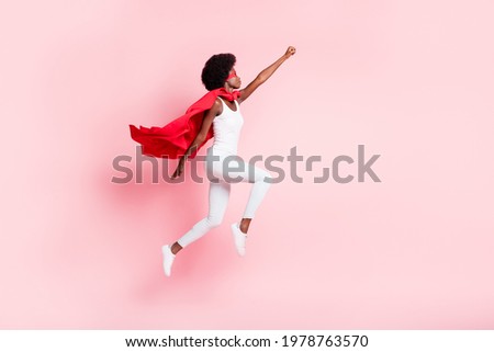 Full length body size view of active slim motivated wavy-haired girl jumping striving isolated on pink pastel color background Foto d'archivio © 