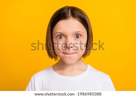 Photo portrait little girl with bob hairdress staring amazed in casual outfit isolated vivid yellow color background Foto d'archivio © 