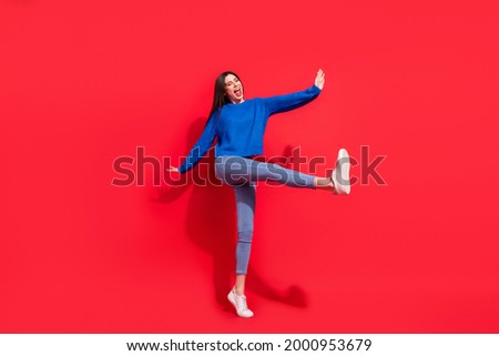 Similar – Image, Stock Photo Dreamy woman raising leg while standing near fence