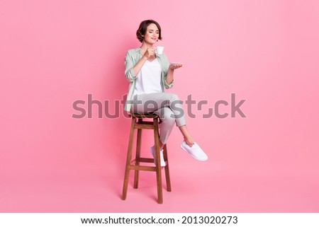 Similar – Image, Stock Photo Dreamy young lady drinking hot beverage near window with adorable weiro bird on shoulder