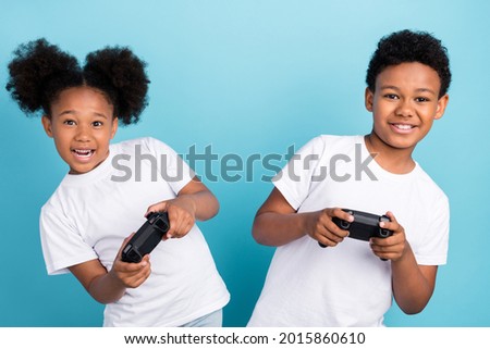 Similar – Image, Stock Photo Children playing video game in evening time