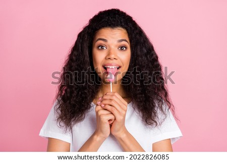 Similar – Image, Stock Photo Black woman eating candy