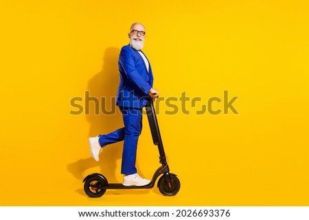 Similar – Image, Stock Photo Man riding an e-scooter