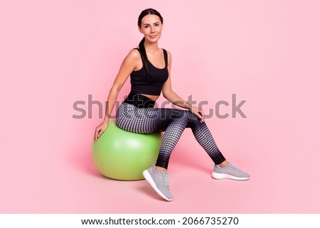 Similar – Image, Stock Photo Smiling woman dressed sportswear with rolled pilates mat in a park