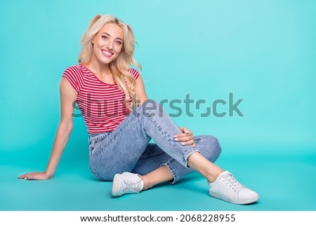 Similar – Image, Stock Photo Woman dressed in red using the mobile on a blue background. Concept of using the mobile. Blue background.