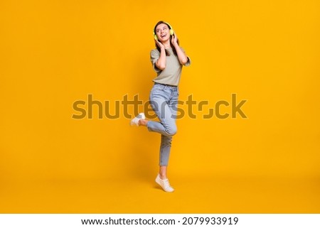 Similar – Image, Stock Photo Cheerful woman listening to music in headphones