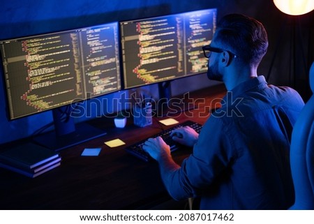 Rear photo of smart skilled introvert tester write typing operating data security evening house dark room Photo stock © 