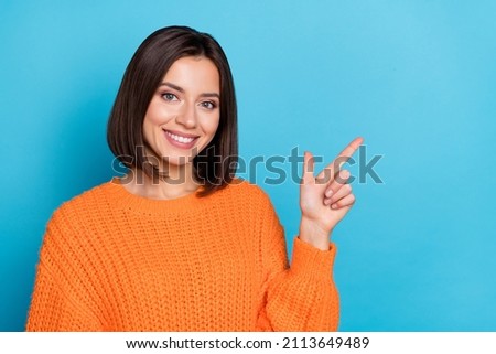 Portrait of attractive cheerful girl demonstrating copy empty space ad advert isolated over bright blue color background Foto stock © 