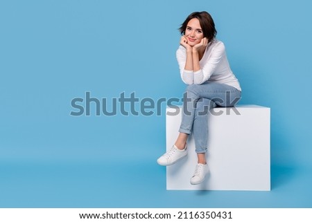 Similar – Image, Stock Photo Positive young lady sitting on bicycle on city street in sunlight