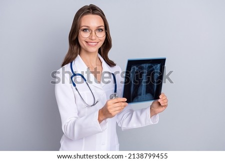 Similar – Image, Stock Photo Young doctor with x-ray film document on wall