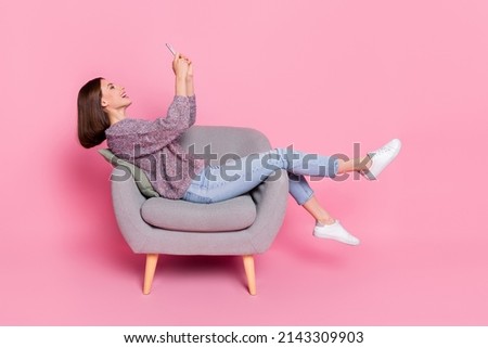 Similar – Image, Stock Photo Dreamy girl sitting on chair near window