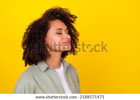 Similar – Image, Stock Photo Cheerful black woman smelling aromatic flower in hothouse