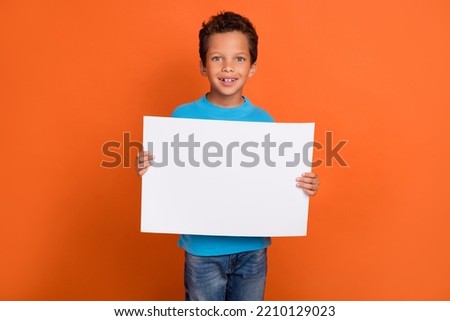 Similar – Image, Stock Photo Cute boy holds on to the horizontal bar and looks at the camera