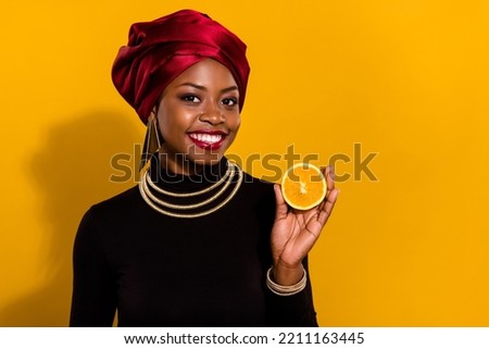 Similar – Image, Stock Photo Woman showing half orange over bowl