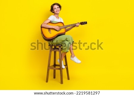 Similar – Image, Stock Photo Positive woman playing guitar in bedroom