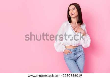 Photo portrait of nice young woman hand touch chest look copyspace compliment dressed stylish white look isolated on pink color background Foto d'archivio © 