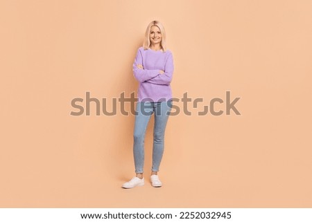 Full size photo of satisfied pretty person crossed arms toothy smile isolated on beige color background Foto stock © 