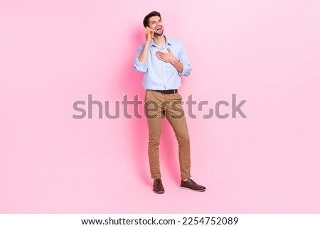 Similar – Image, Stock Photo Man talking on smartphone while browsing laptop