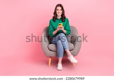 Similar – Image, Stock Photo Young woman wearing green oversize sweater enjoying a windy day in a colorful city