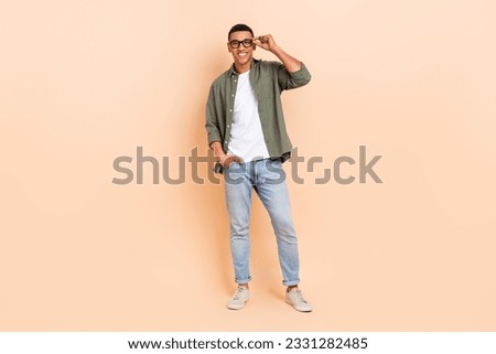 Image, Stock Photo Trendy ethnic model touching hair in projector light