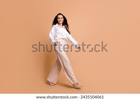 Similar – Image, Stock Photo Adorable girl walking and looking at camera on seaside at sunset