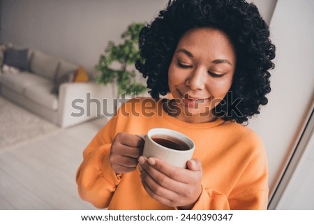 Similar – Image, Stock Photo Dreamy young lady drinking hot beverage near window with adorable weiro bird on shoulder