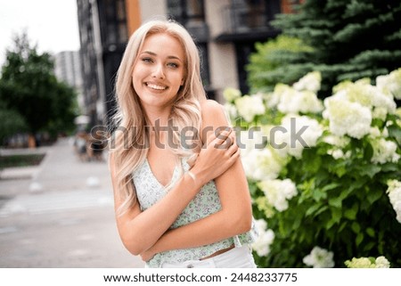 Similar – Image, Stock Photo Blond girl and a blond Labrador sitting on a wall with graffiti on the beach