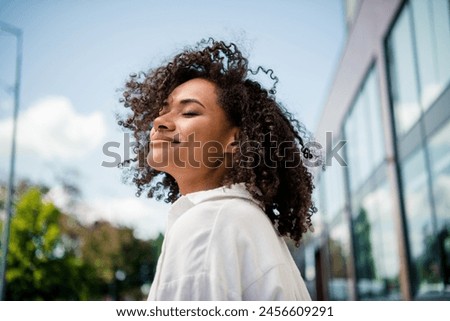 Similar – Foto Bild glückliche Frau mit geschlossenen Augen sitzt auf Pier vor gefrorenen See in der Stadt. Reisen und Lifestyle im Winter in der Stadt