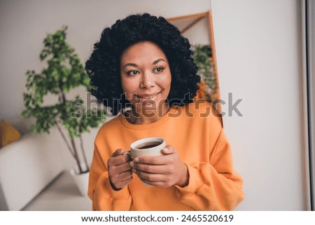 Similar – Image, Stock Photo Dreamy young lady drinking hot beverage near window with adorable weiro bird on shoulder